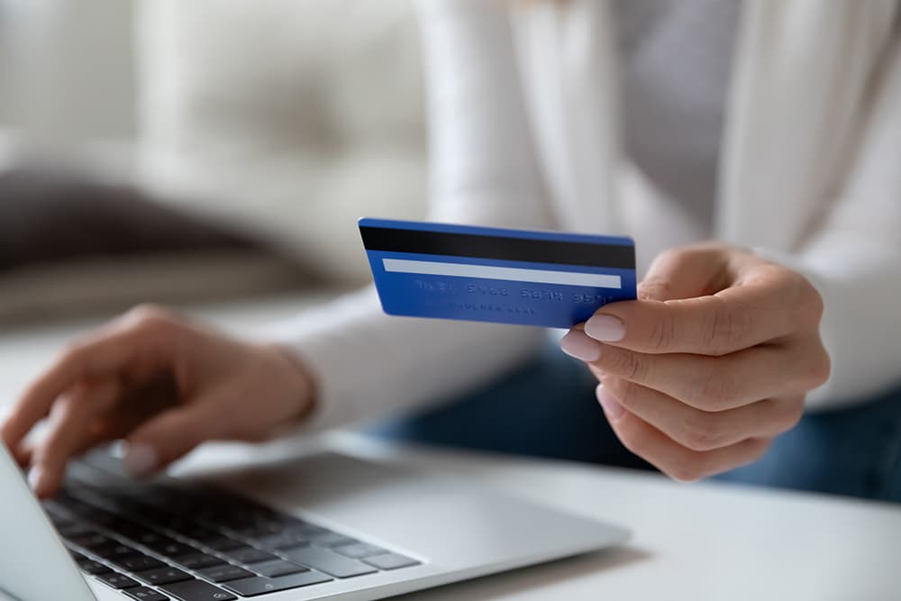 Ecommerce fraud of woman holding credit card